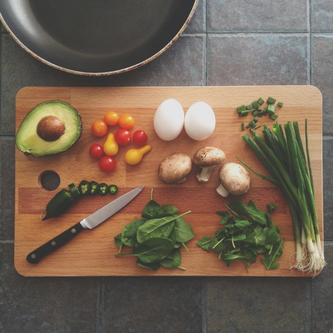 Vegetables laid out on a prep board before service